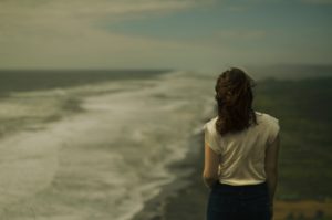 Woman looking at the ocean