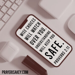 How To Live Life on Purpose. Cell phone with scripture on screen, computer keyboard.