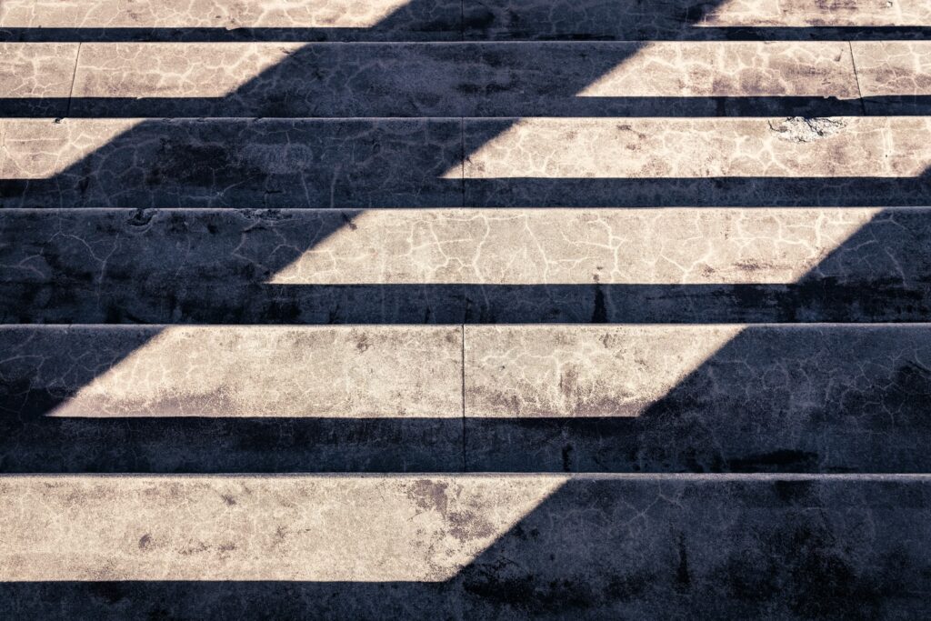 Building the Church- one person at a time, Growing God's Kingdom, shadow of person on gray concrete pavement
